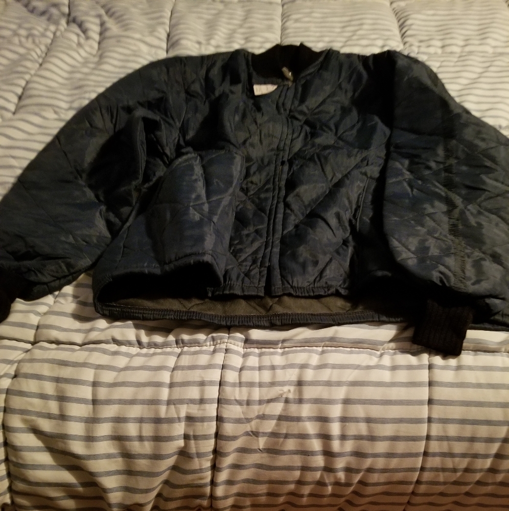 Navy blue windbreaker jacket with pockets